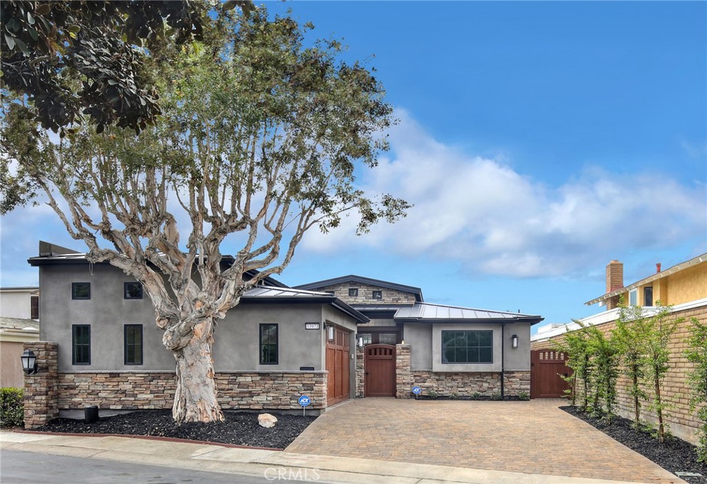 33971 Nauticus Isle Dana Point, CA 92629 - Photo 21 of 27 a front view of a house with a tree