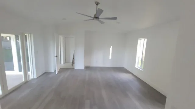 a view of an empty room with a window