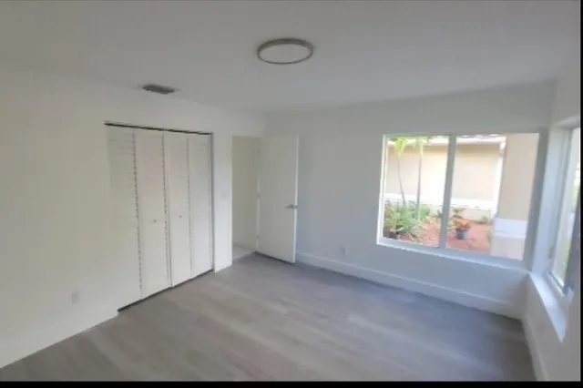 a view of an empty room with a window