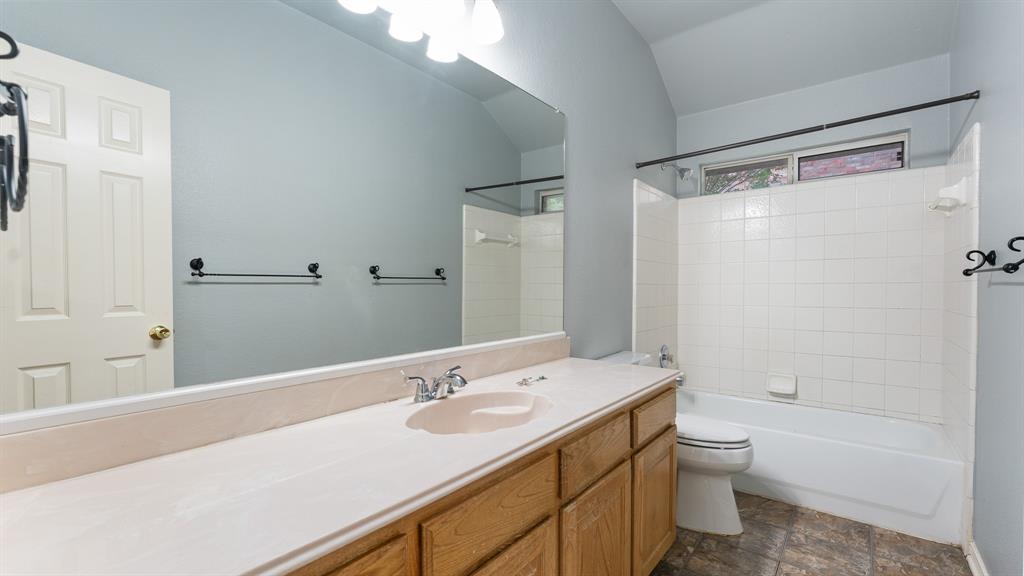 525 Mustang Ridge Drive Murphy, TX 75094 - Photo 12 of 26 a bathroom with a granite countertop sink toilet and shower