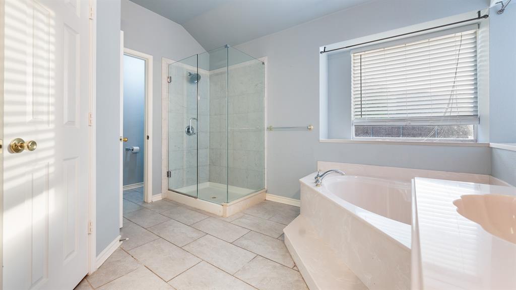 525 Mustang Ridge Drive Murphy, TX 75094 - Photo 16 of 26 a spacious bathroom with a bathtub a shower and a sink