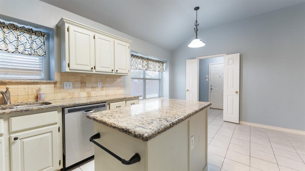 525 Mustang Ridge Drive Murphy, TX 75094 - Photo 2 of 26 a kitchen with granite countertop cabinets stainless steel appliances a sink and a window
