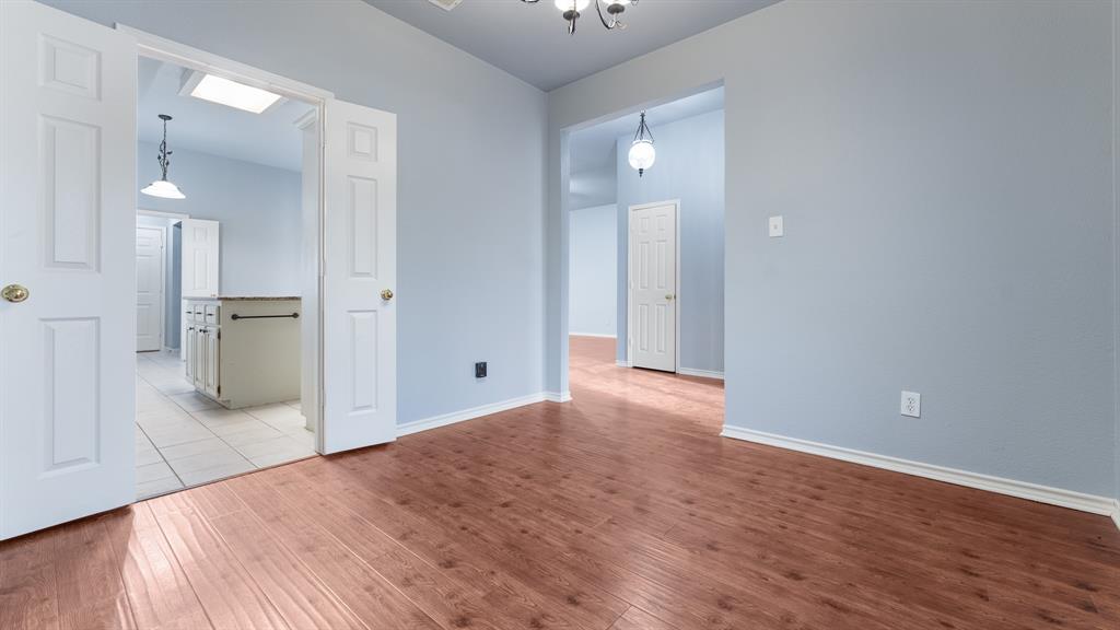 525 Mustang Ridge Drive Murphy, TX 75094 - Photo 6 of 26 a view of a kitchen with a refrigerator and a sink