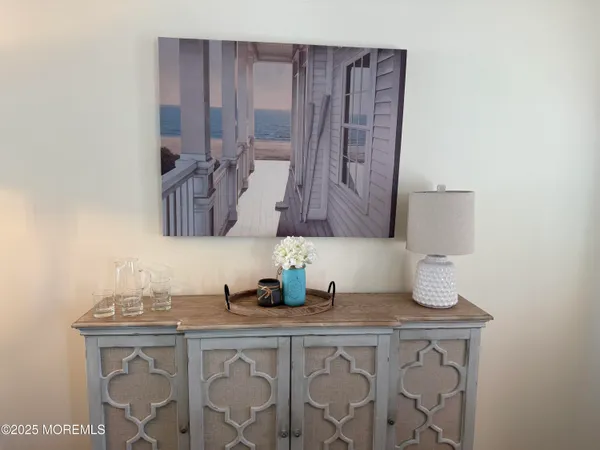 a bathroom with a sink vanity granite and a mirror