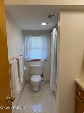 a bathroom with a toilet and a sink