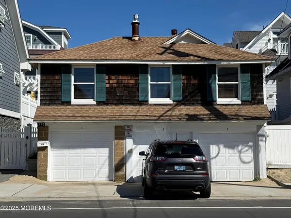 a front view of a house with a garage