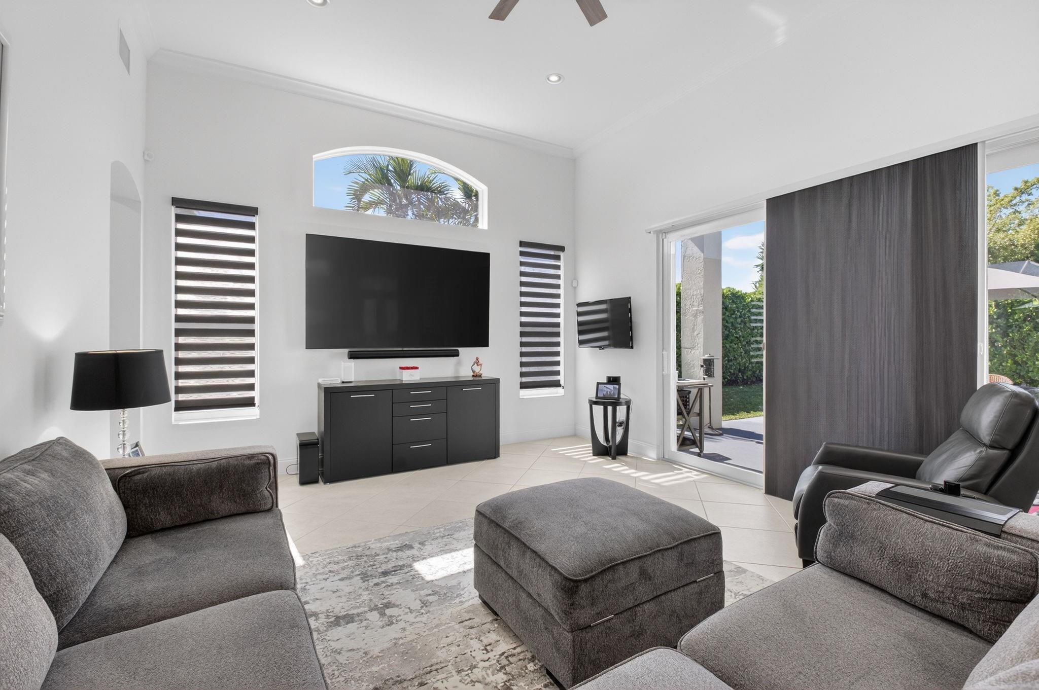 10078 Lexington Estates Boulevard Boca Raton, FL 33428 - Photo 14 of 49 a living room with furniture and a flat screen tv