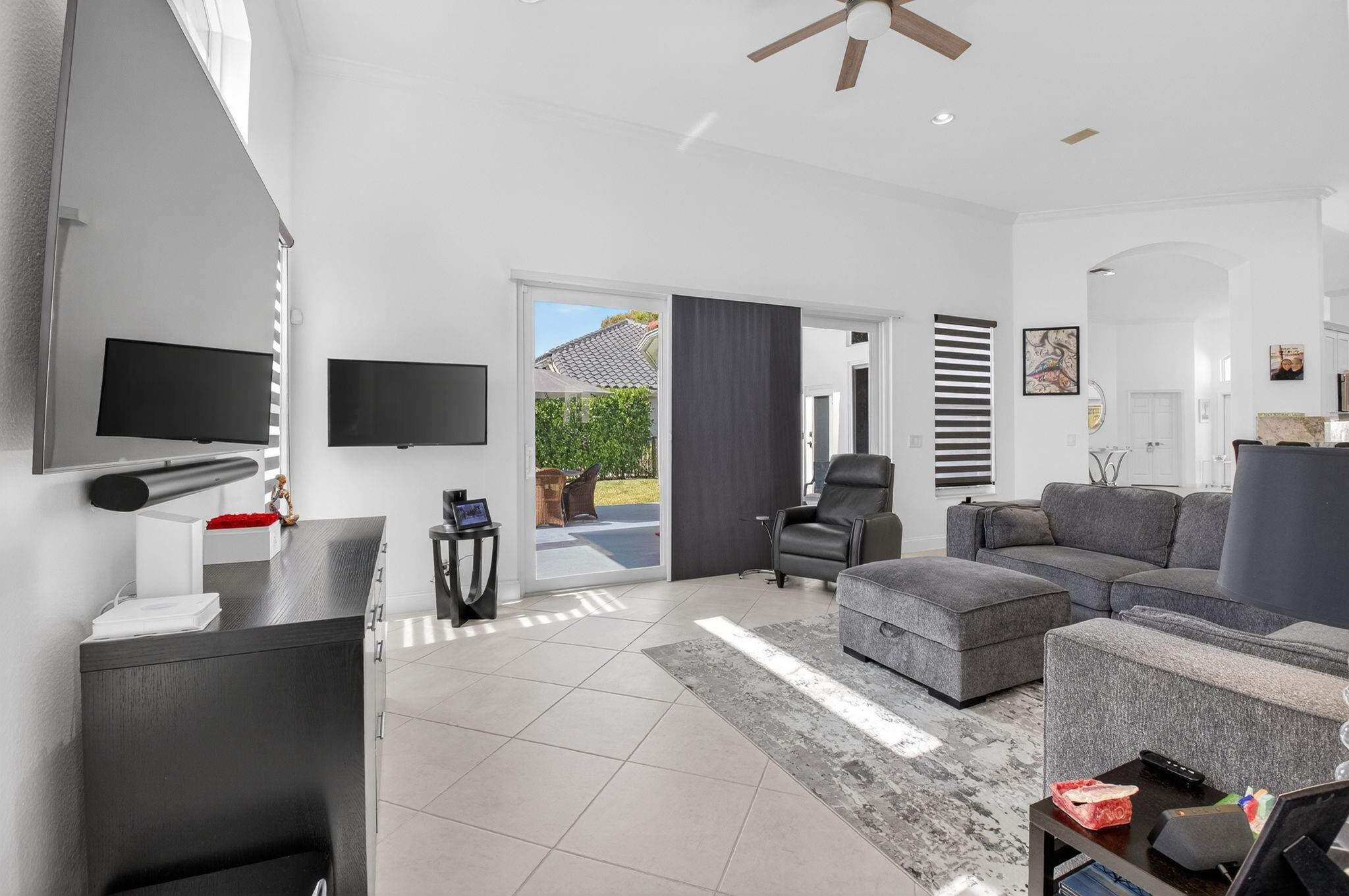 10078 Lexington Estates Boulevard Boca Raton, FL 33428 - Photo 15 of 49 a living room with furniture and a flat screen tv