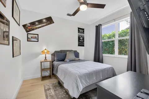 a bedroom with a bed and window