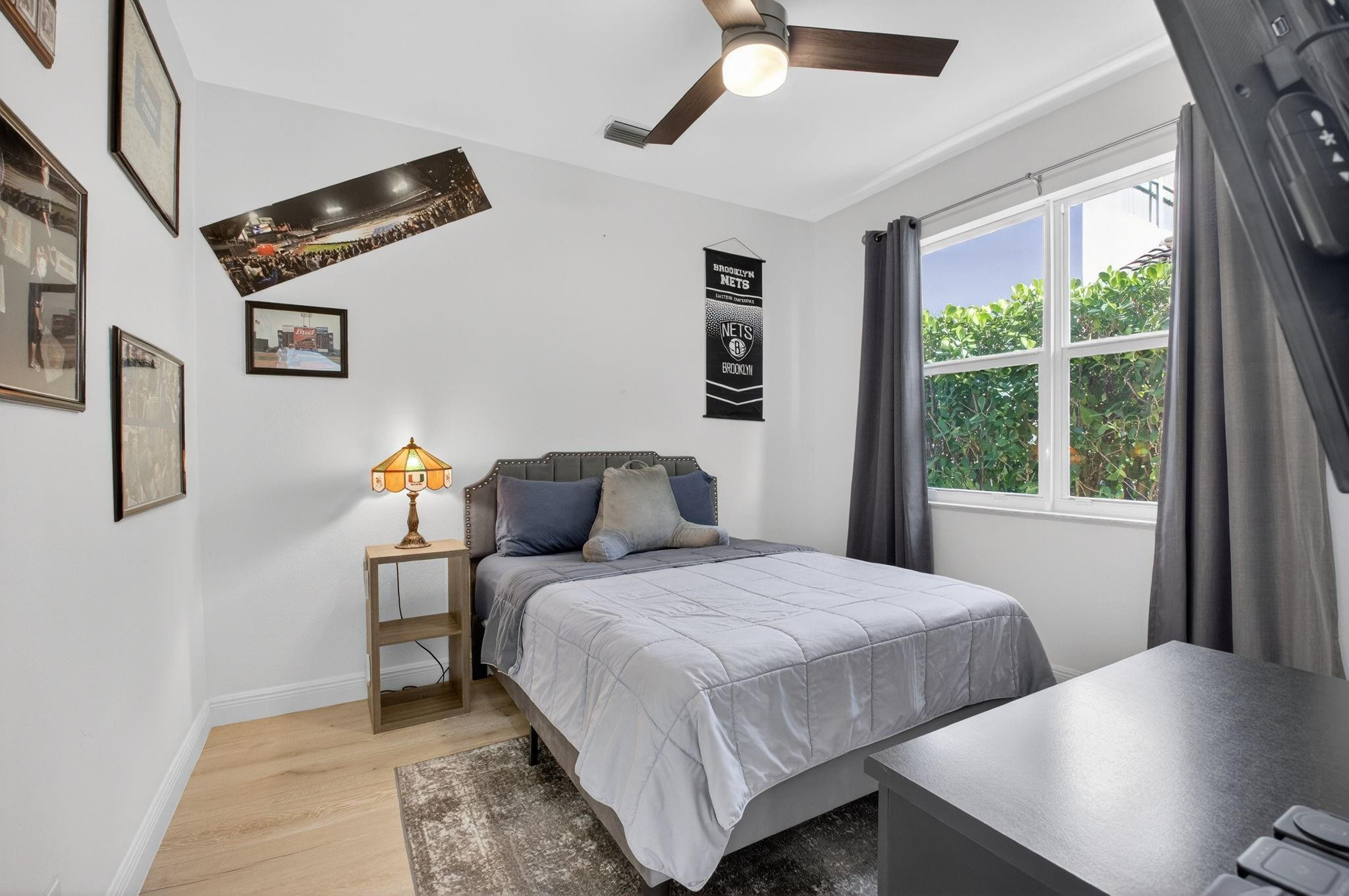 10078 Lexington Estates Boulevard Boca Raton, FL 33428 - Photo 16 of 49 a bedroom with a bed and window