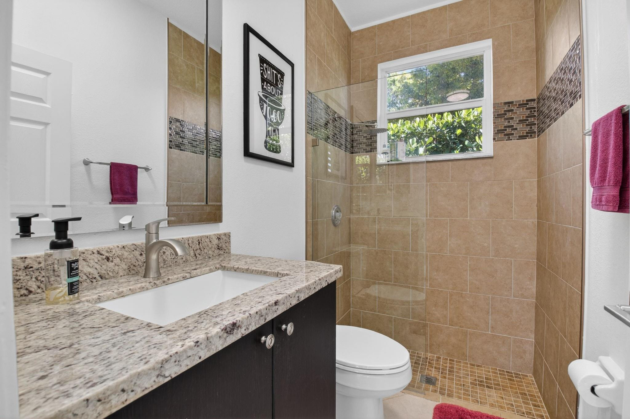 10078 Lexington Estates Boulevard Boca Raton, FL 33428 - Photo 17 of 49 a bathroom with a granite countertop sink a toilet a mirror and shower