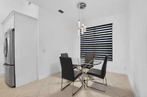 a work room with furniture and a rug