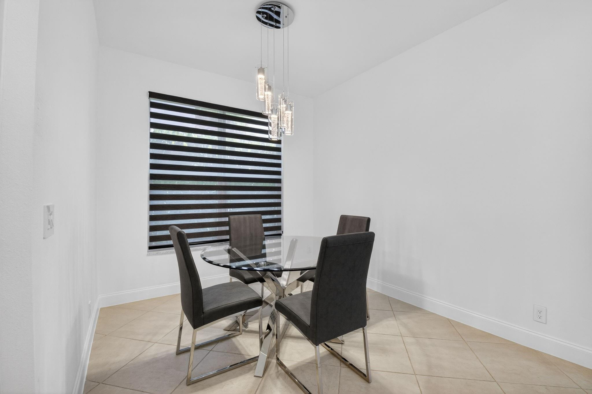 10078 Lexington Estates Boulevard Boca Raton, FL 33428 - Photo 20 of 49 a work room with furniture and a rug