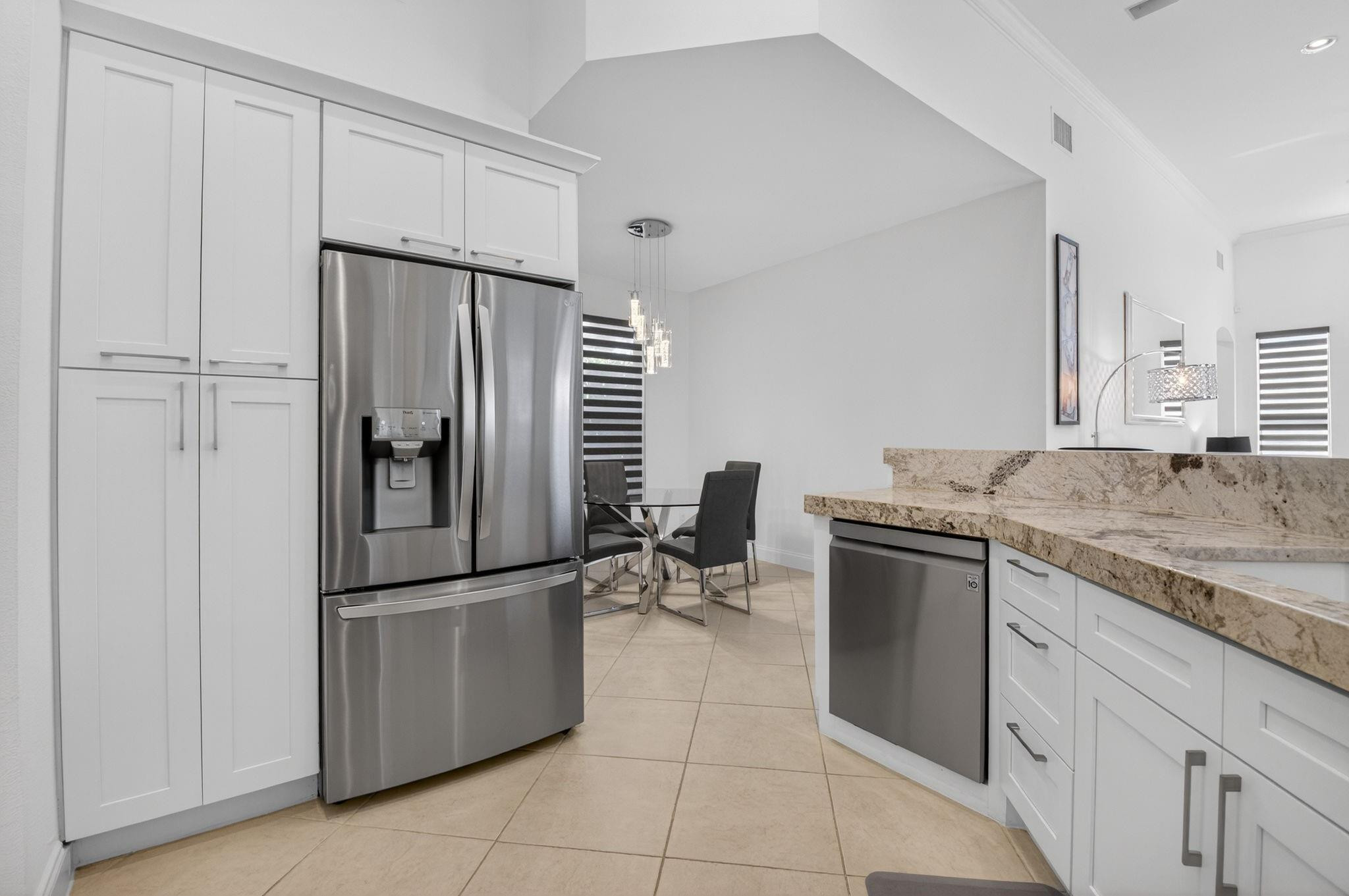 10078 Lexington Estates Boulevard Boca Raton, FL 33428 - Photo 24 of 49 a kitchen with granite countertop a refrigerator and a sink