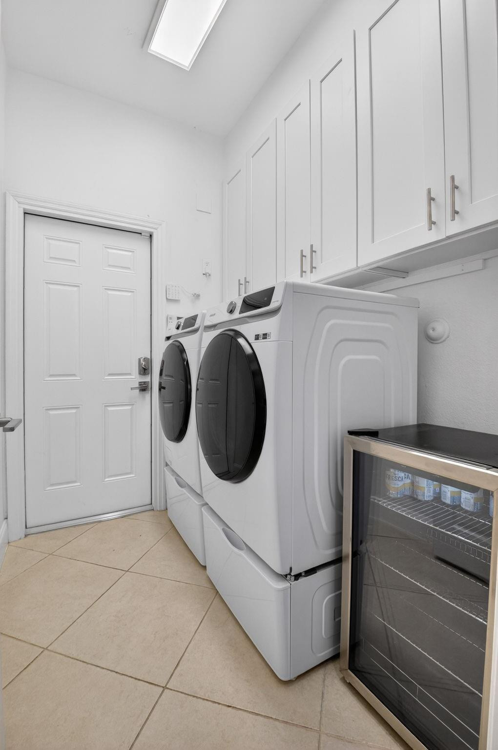 10078 Lexington Estates Boulevard Boca Raton, FL 33428 - Photo 27 of 49 a utility room with dryer and washer