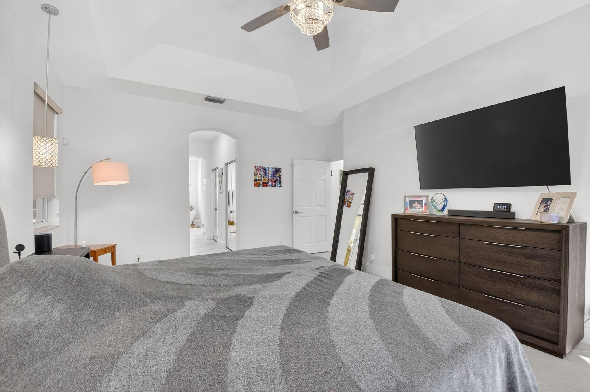 10078 Lexington Estates Boulevard Boca Raton, FL 33428 - Photo 31 of 49 a bed room with a bed and a television