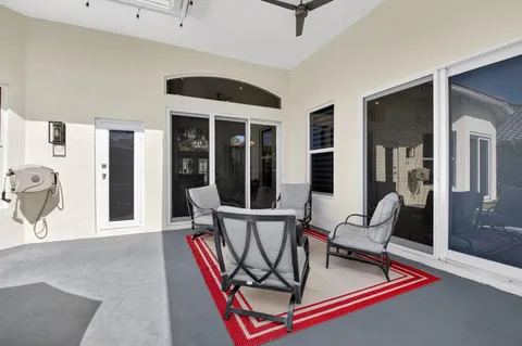 a patio with a yard table and chairs