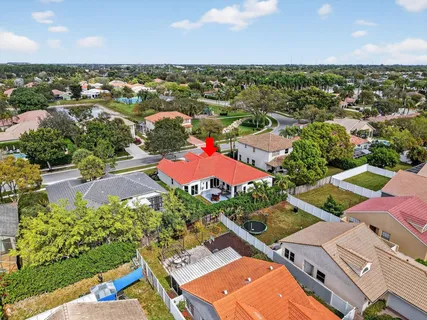 an aerial view of residential houses with outdoor space