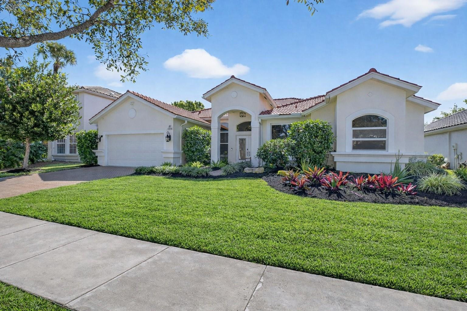 10078 Lexington Estates Boulevard Boca Raton, FL 33428 - Photo 4 of 49 a front view of house with yard and green space