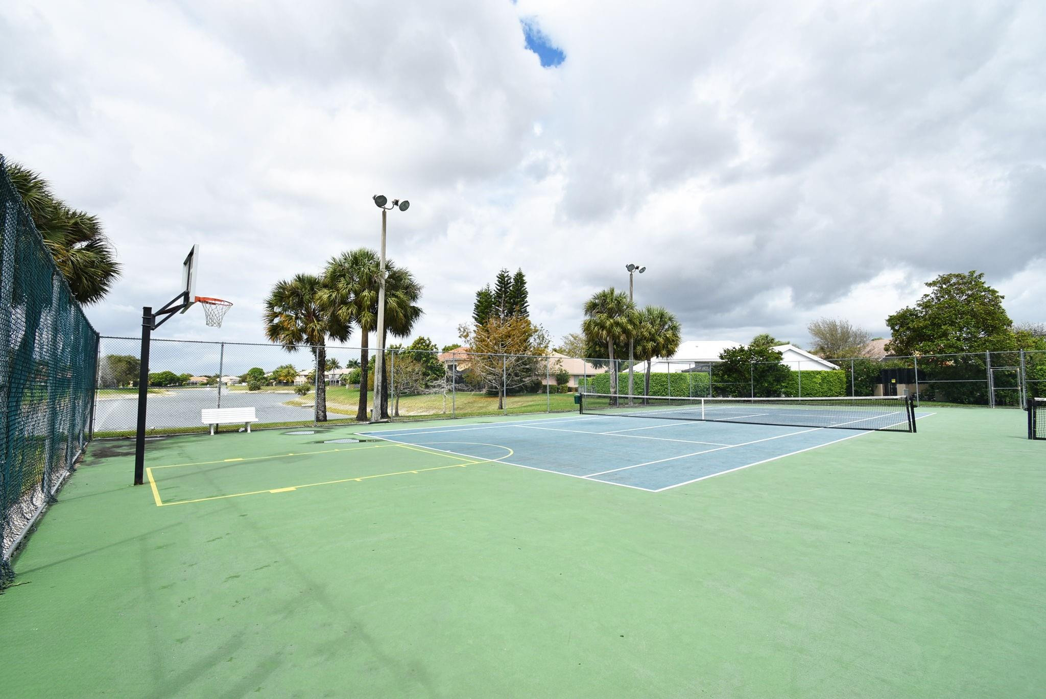 10078 Lexington Estates Boulevard Boca Raton, FL 33428 - Photo 44 of 49 a view of a playground and trees