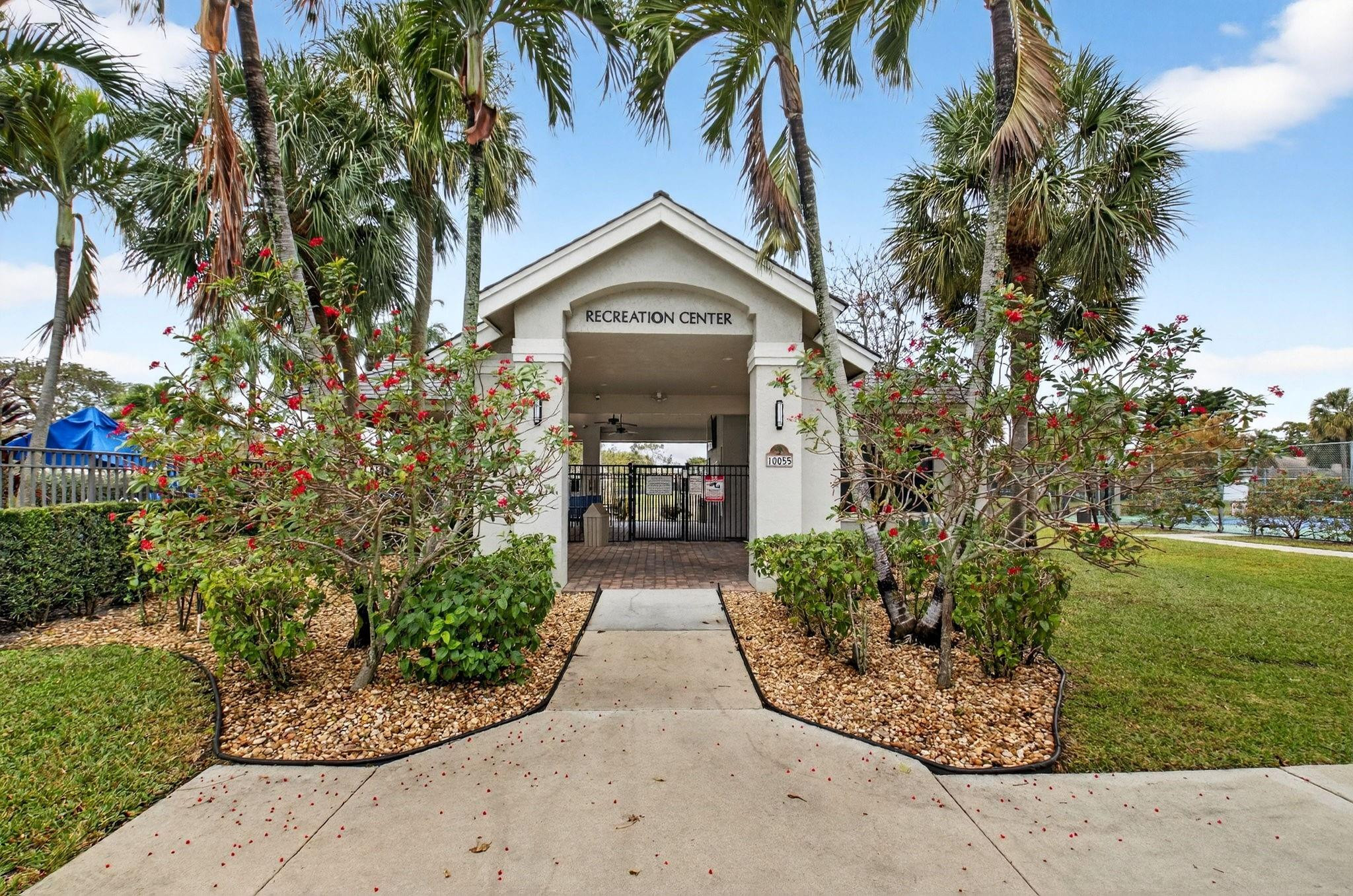 10078 Lexington Estates Boulevard Boca Raton, FL 33428 - Photo 46 of 49 a view of a pathway with a house in the background
