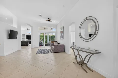 a view of a livingroom with furniture and a flat screen tv