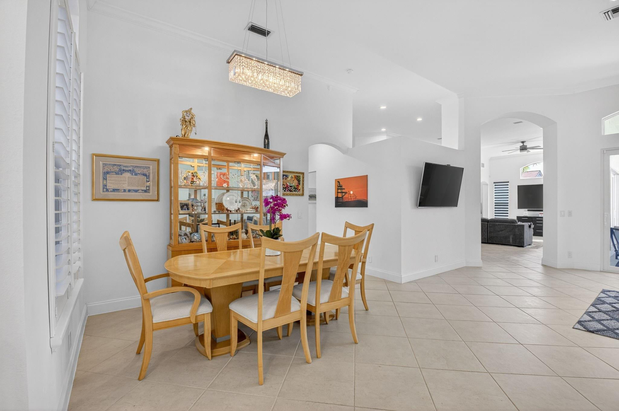 10078 Lexington Estates Boulevard Boca Raton, FL 33428 - Photo 7 of 49 a view of a dining room with furniture and kitchen view