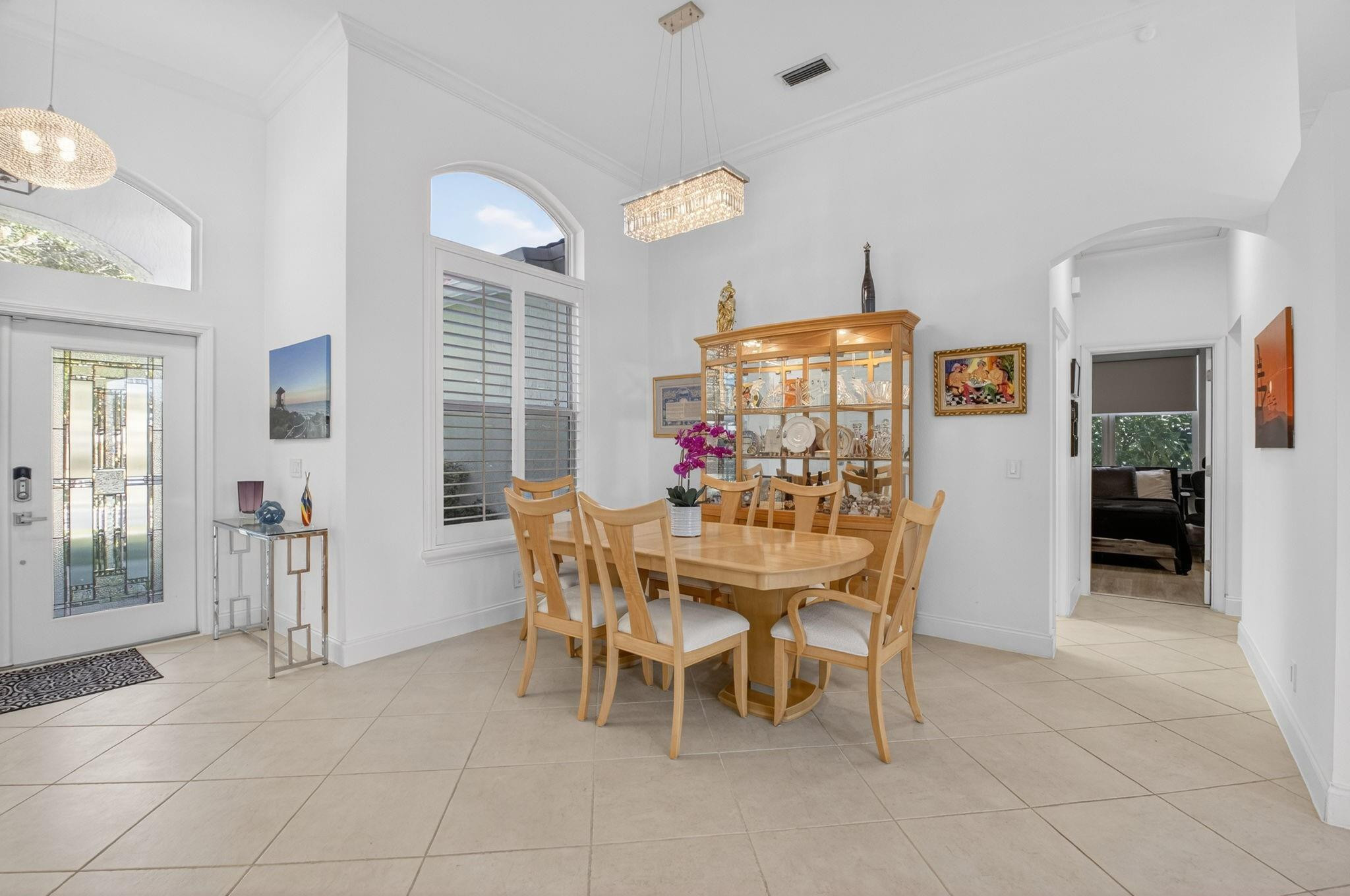 10078 Lexington Estates Boulevard Boca Raton, FL 33428 - Photo 8 of 49 a dining room with furniture and window