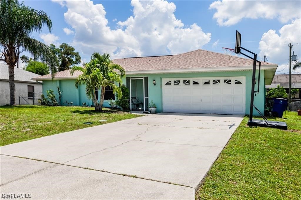 17209 Trellis Road Fort Myers, FL 33967 - Photo 1 of 23 a view of a house with a yard and potted plants