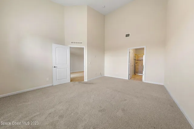 a bathroom with a granite countertop sink mirror and double