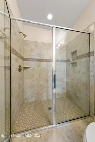 a bathroom with a sink a mirror and a bathtub