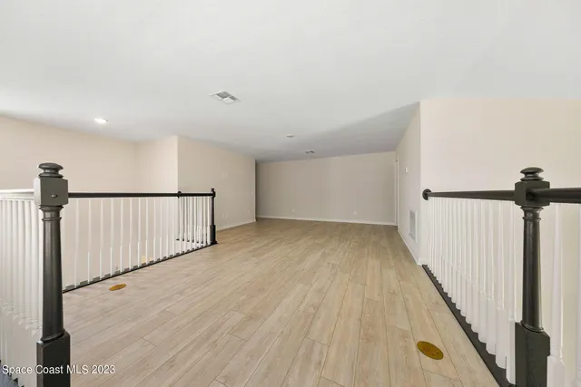 a view of staircase with rug floor