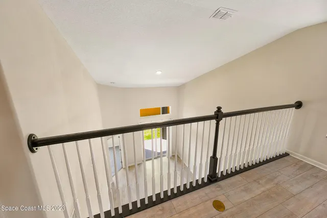 a view of a living room with wooden floor