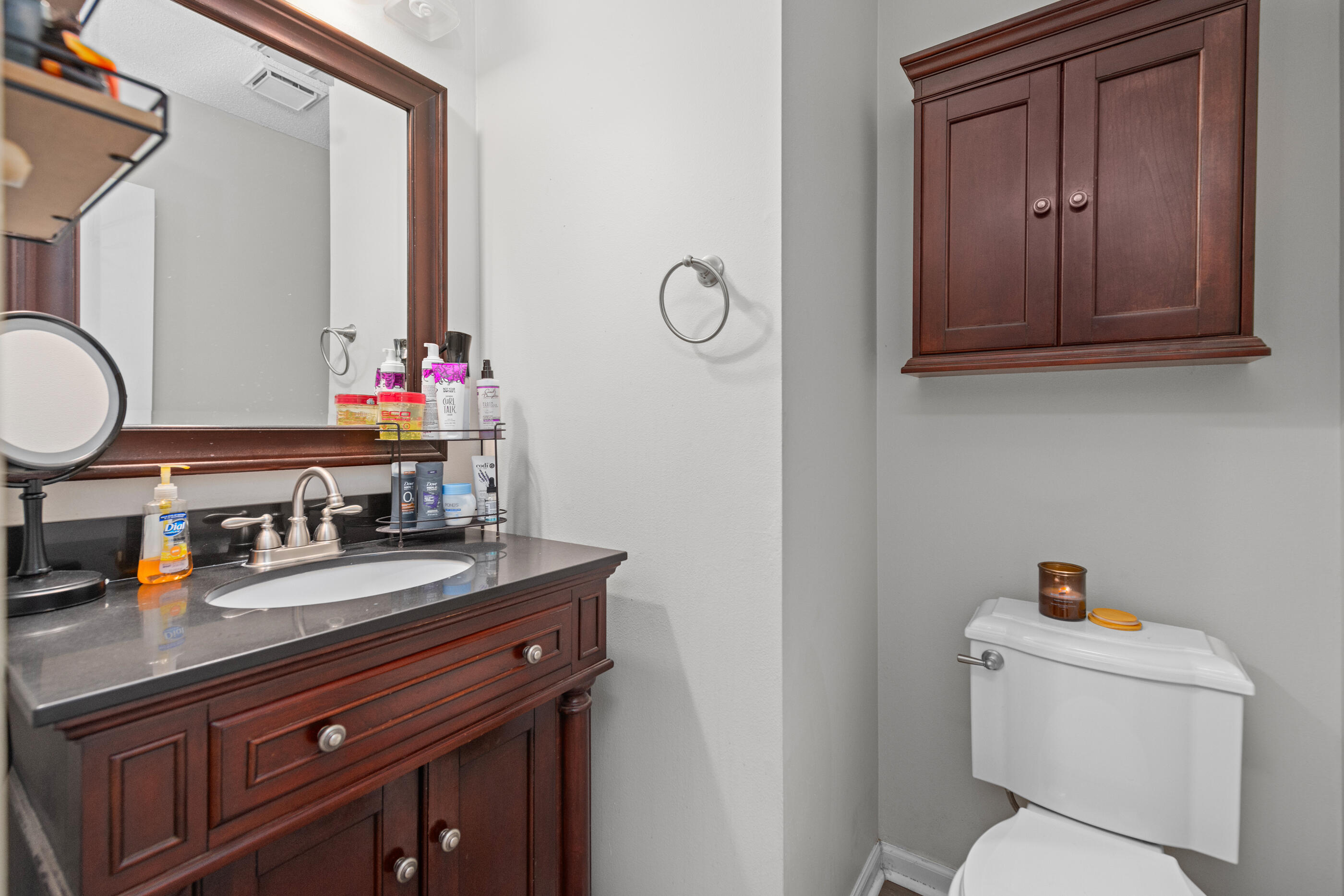 226 Springwood Circle Crestview, FL 32536 - Photo 14 of 27 a bathroom with a toilet a sink and a mirror