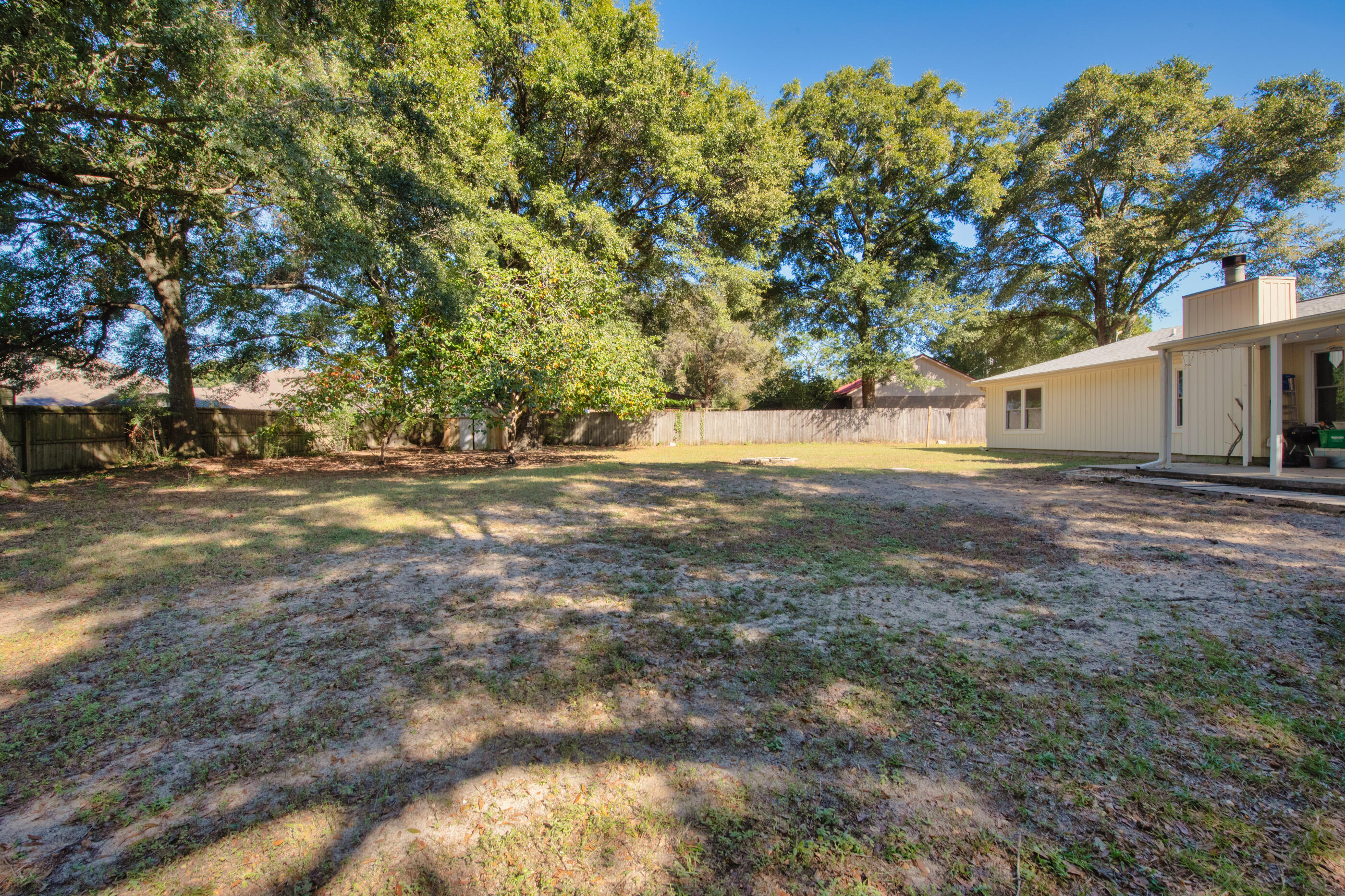 226 Springwood Circle Crestview, FL 32536 - Photo 19 of 27 a view of backyard with large trees