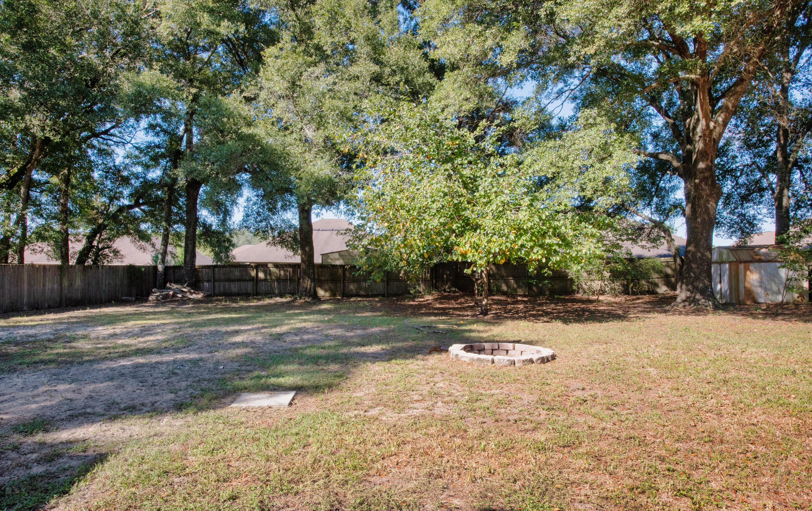 226 Springwood Circle Crestview, FL 32536 - Photo 24 of 27 a view of a yard with a tree