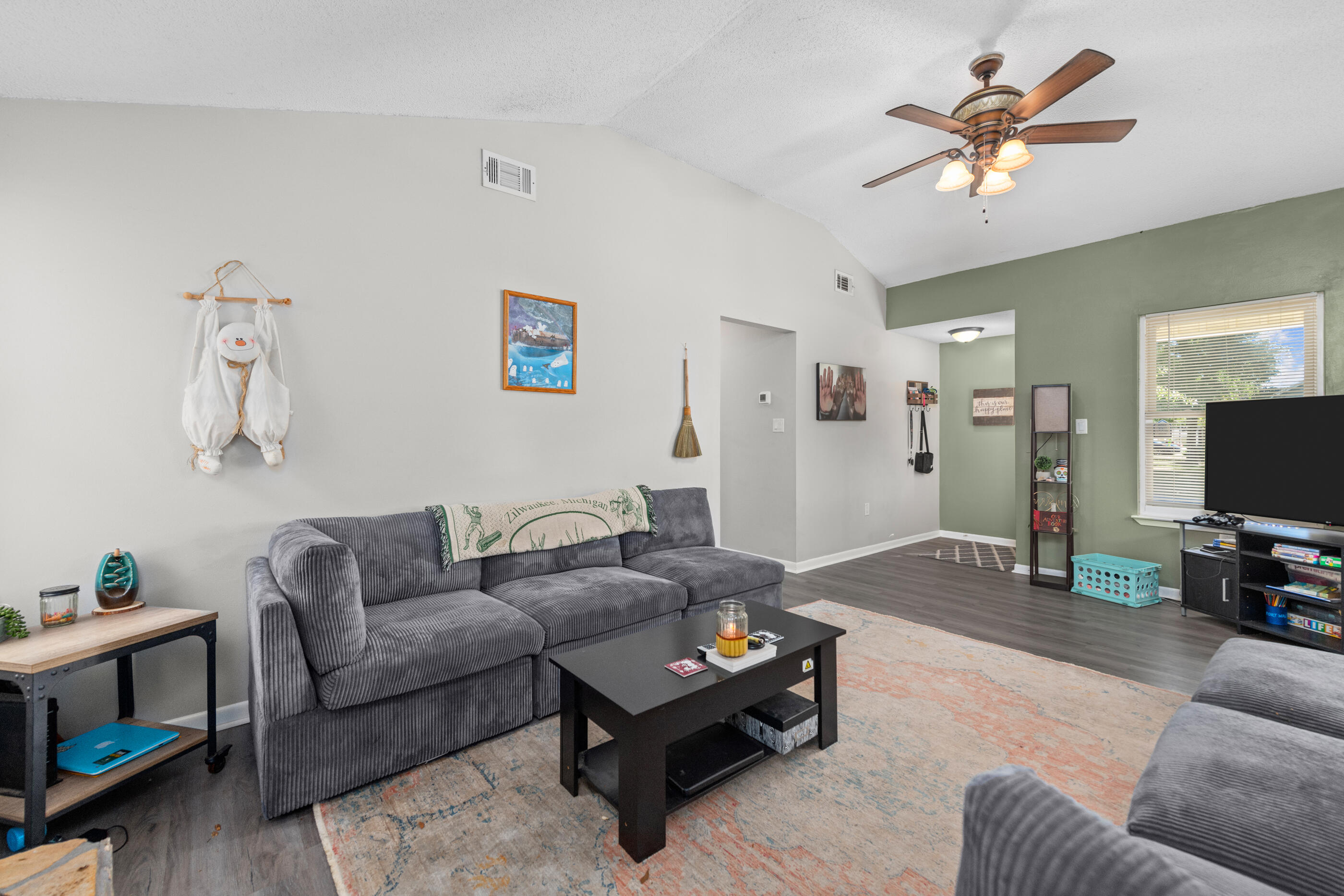 226 Springwood Circle Crestview, FL 32536 - Photo 5 of 27 a living room with furniture and a flat screen tv