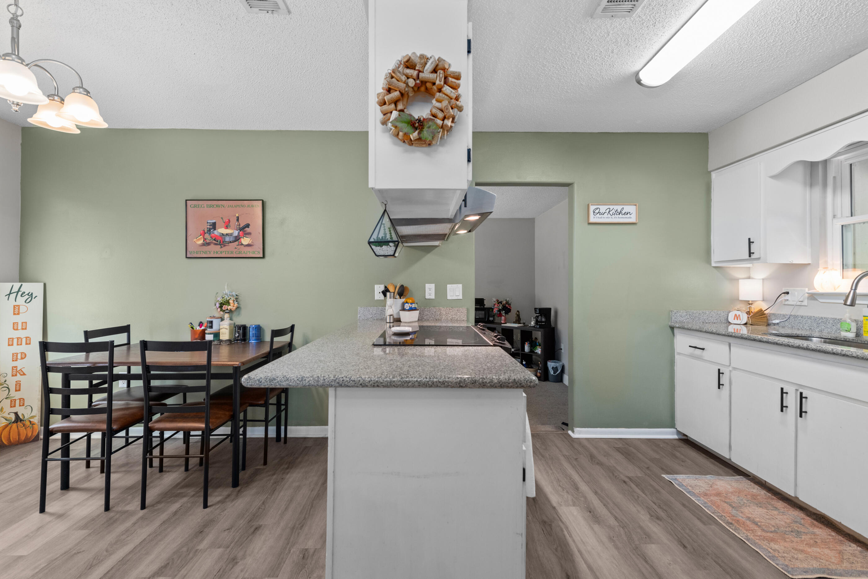 226 Springwood Circle Crestview, FL 32536 - Photo 8 of 27 a view of a kitchen with a table and chairs