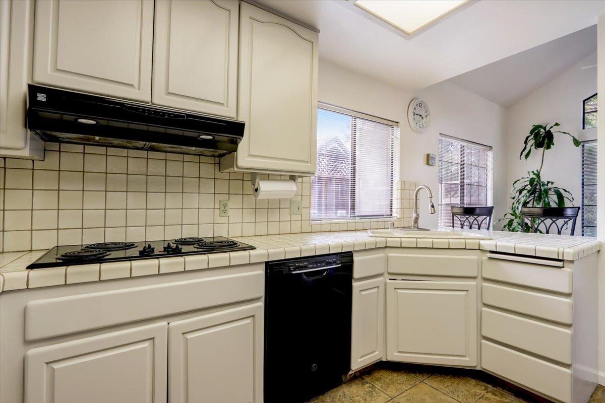952 Corbel Common Fremont, CA 94539 - Photo 15 of 50 a kitchen with a sink and cabinets