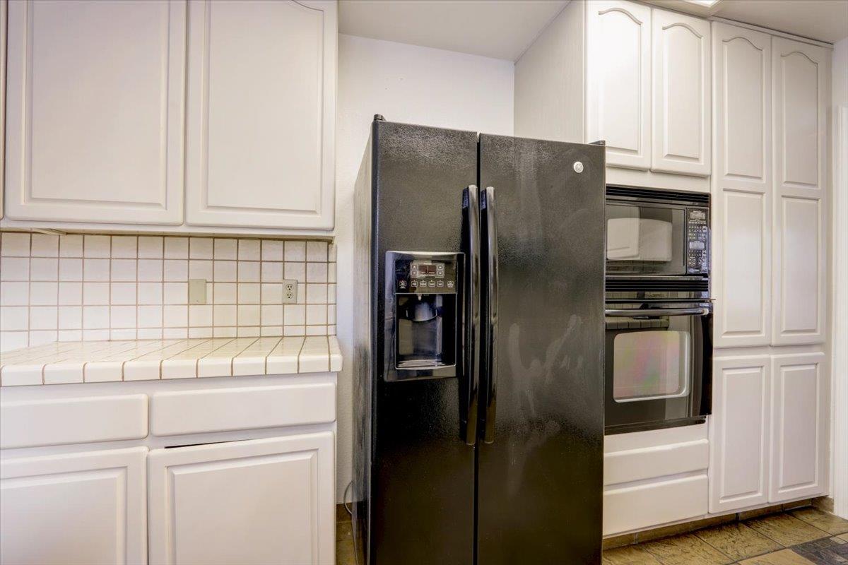 952 Corbel Common Fremont, CA 94539 - Photo 16 of 50 a kitchen with stainless steel appliances cabinets and a refrigerator