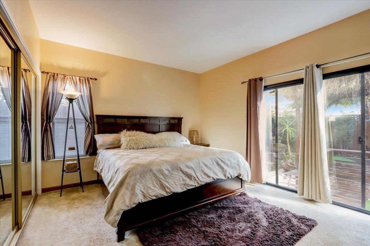 952 Corbel Common Fremont, CA 94539 - Photo 22 of 50 a bedroom with a bed and a window