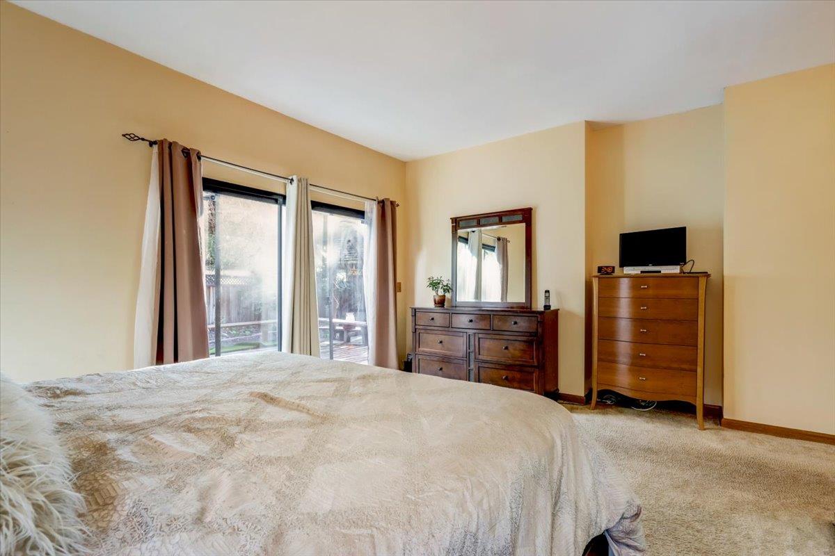 952 Corbel Common Fremont, CA 94539 - Photo 23 of 50 a bedroom with a bed and wooden floor