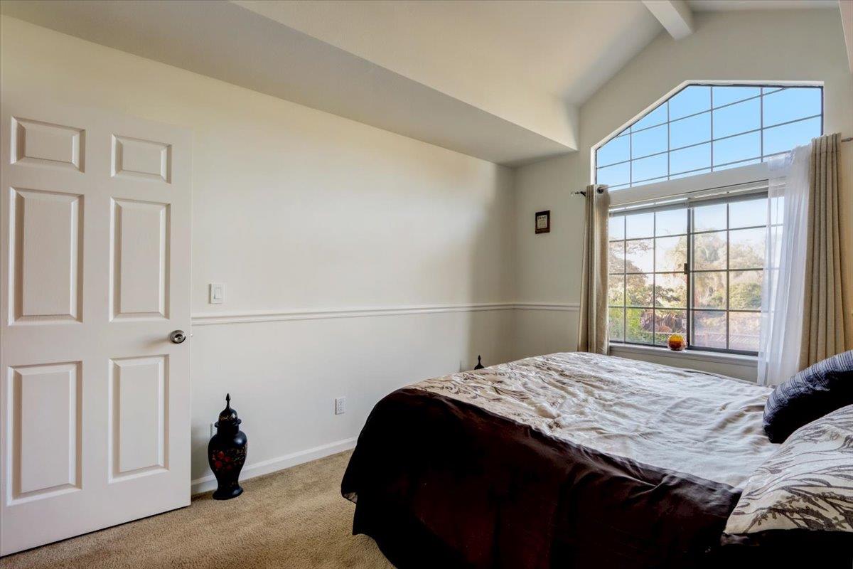 952 Corbel Common Fremont, CA 94539 - Photo 26 of 50 a bedroom with a bed and a window