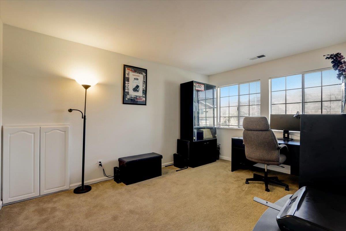 952 Corbel Common Fremont, CA 94539 - Photo 27 of 50 a livingroom with workspace and a window