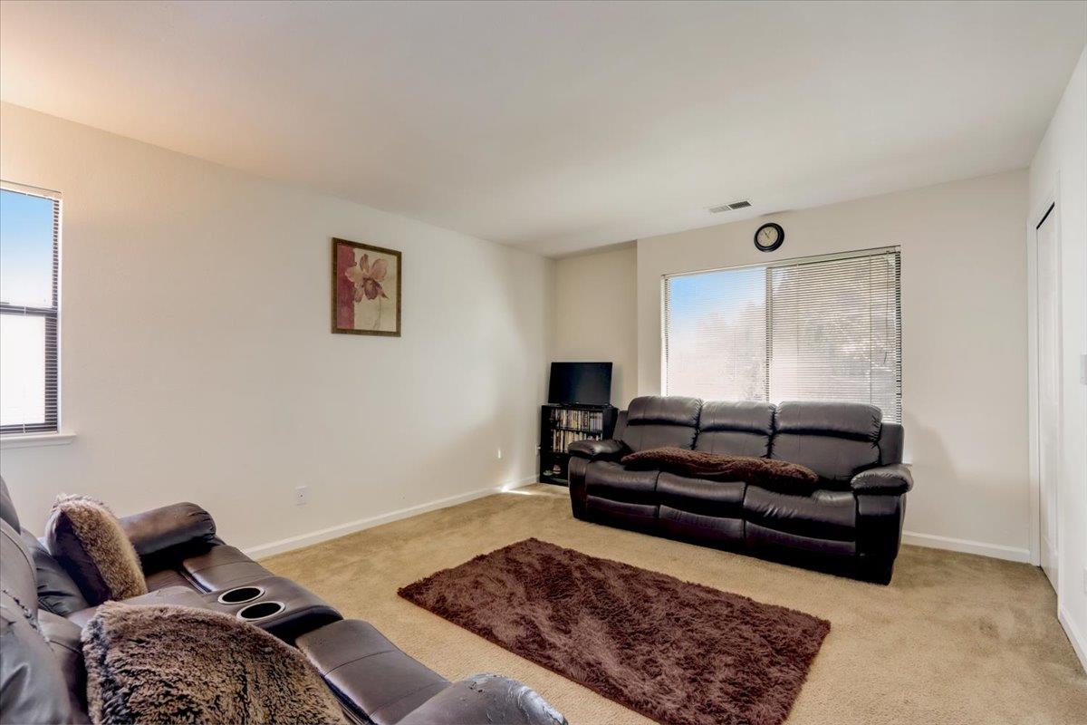 952 Corbel Common Fremont, CA 94539 - Photo 30 of 50 a living room with furniture rug and a window