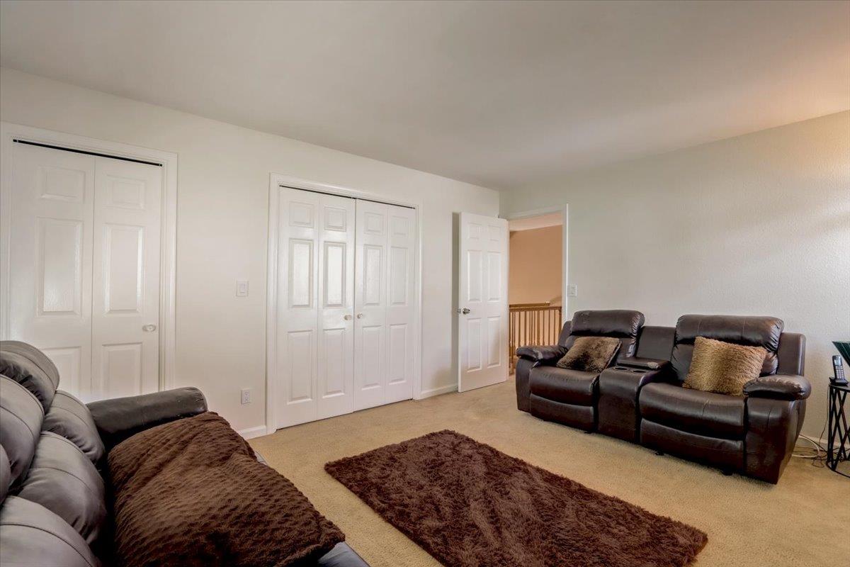952 Corbel Common Fremont, CA 94539 - Photo 31 of 50 a living room with furniture and a rug