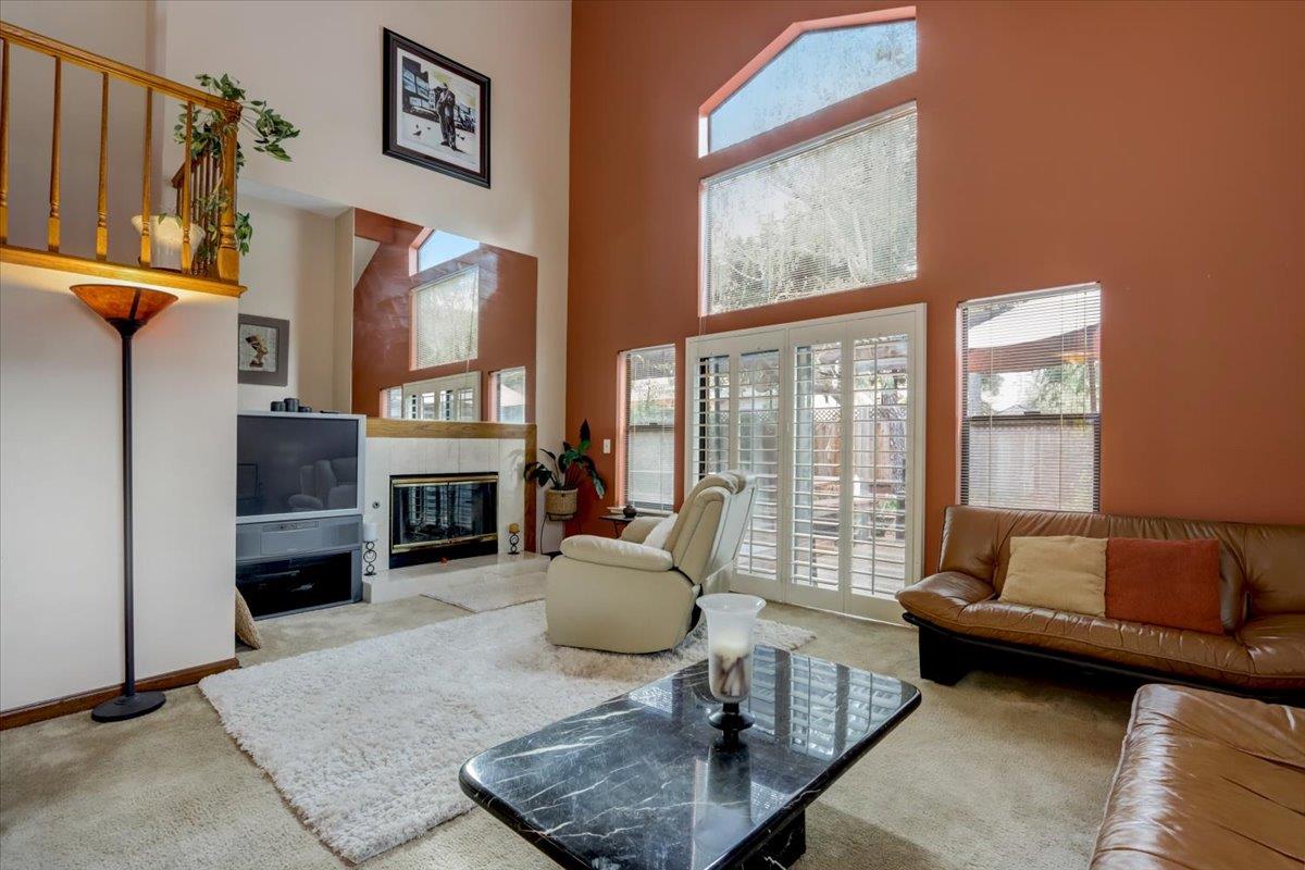 952 Corbel Common Fremont, CA 94539 - Photo 7 of 50 a living room with furniture and a fireplace