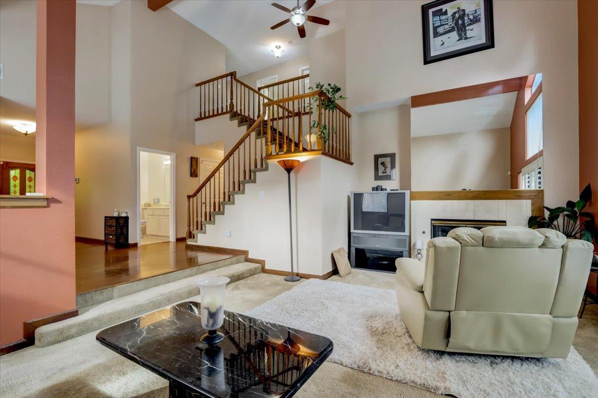 952 Corbel Common Fremont, CA 94539 - Photo 9 of 50 a living room with furniture and a chandelier