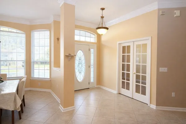 a kitchen with stainless steel appliances granite countertop a stove a sink and white cabinets