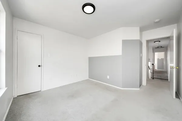 a view of bathroom with white walls
